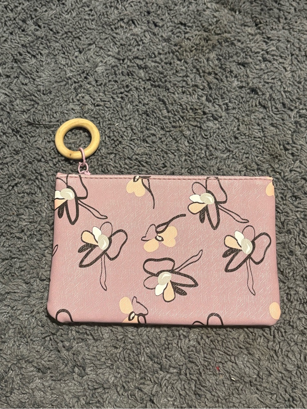 NWOT lavender floral covered pouch with a wooded zipper handle